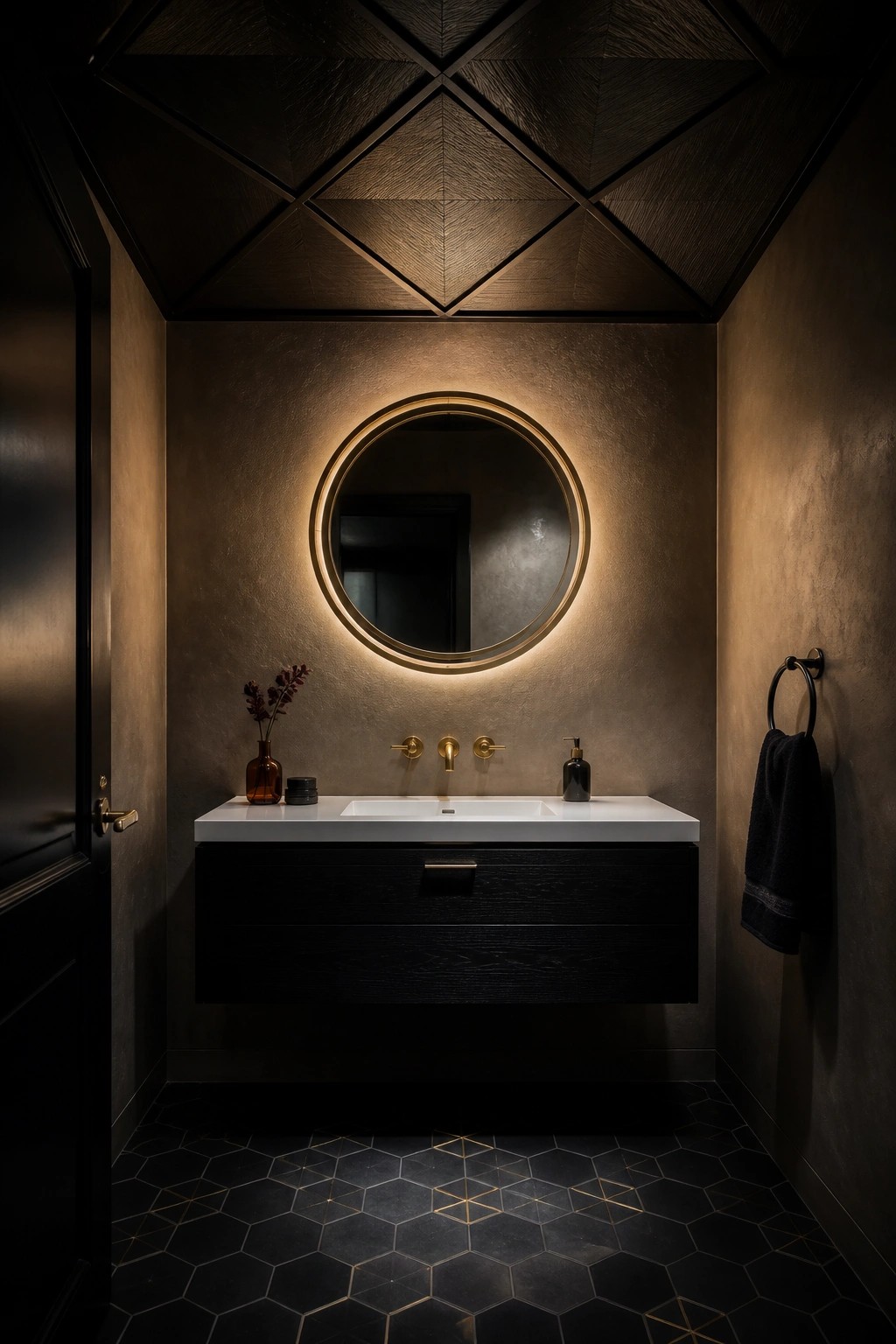 A bathroom interior featuring a dark wood ceiling with a geometric diamond pattern, a round illuminated mirror above a floating black vanity, and dark hexagonal floor tiles.
